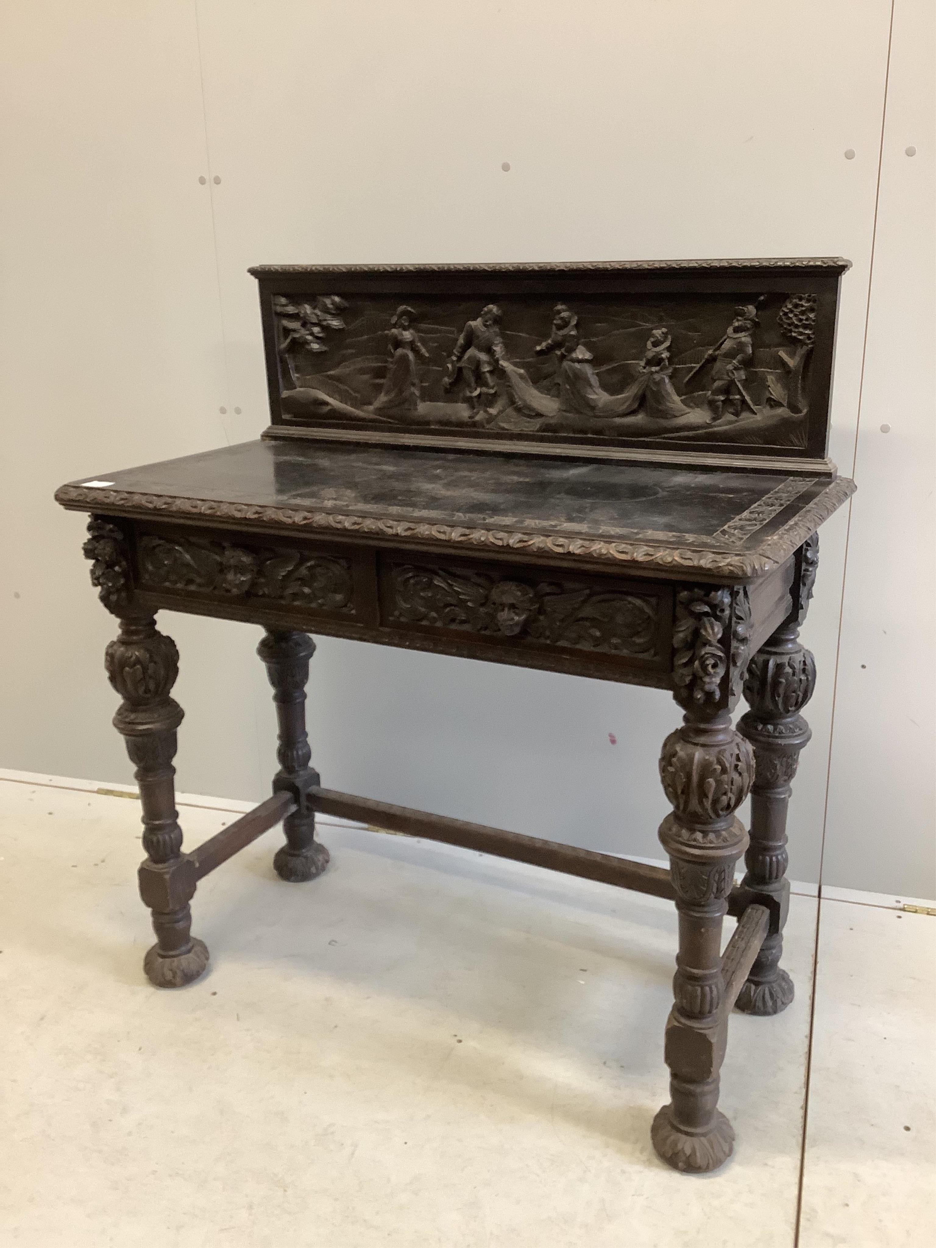 A late 19th century Flemish style carved oak side table, width 109cm, depth 53cm, height 116cm. Condition - poor to fair